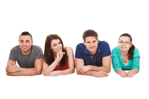 College Students Lying Over White Background — Stock Photo, Image