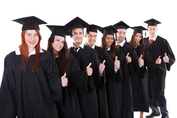 Graduate students standing in row showing thumbs up Stock Image