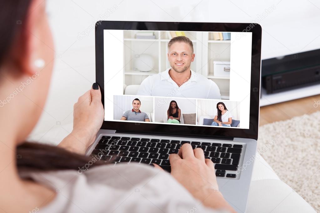 Young Woman Using Laptop For Videochatting