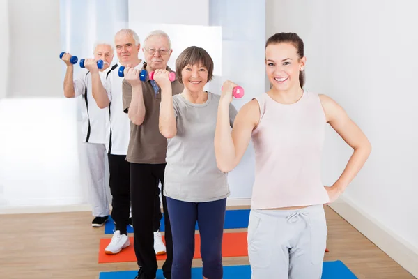 Trainer And Customers Exercising With Dumbbells — Stock Photo, Image