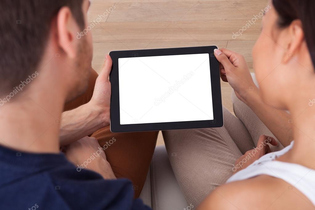 Young Couple Using Digital Tablet Together