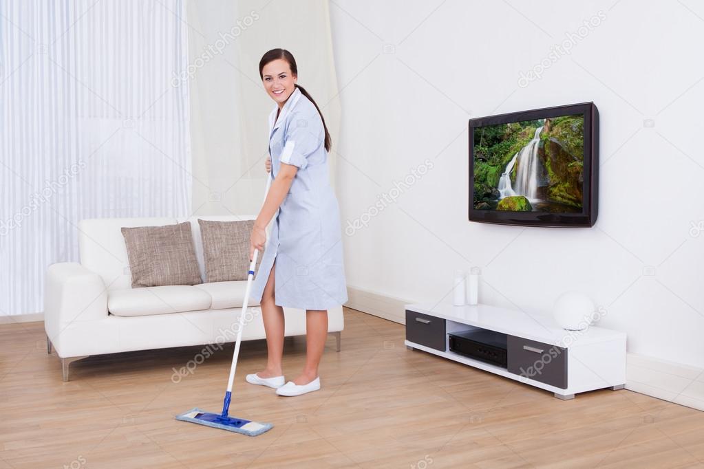 Maid Cleaning Floor With Mop