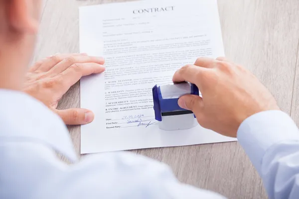 Businessman Stamping Contract Paper On Table — Stock Photo, Image