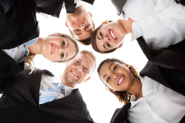 Portrait Of Business People Forming Huddle — Stock Photo, Image