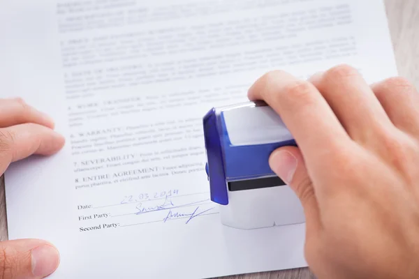 Businessman Stamping Contract Paper On Table — Stock Photo, Image