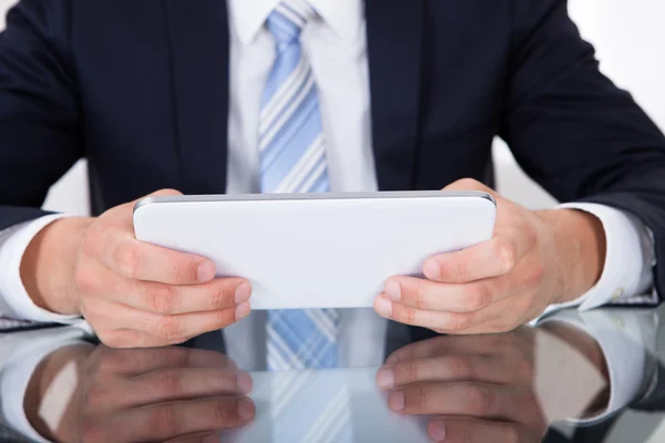 Businessman Using Digital Tablet At Desk — Stock Photo, Image