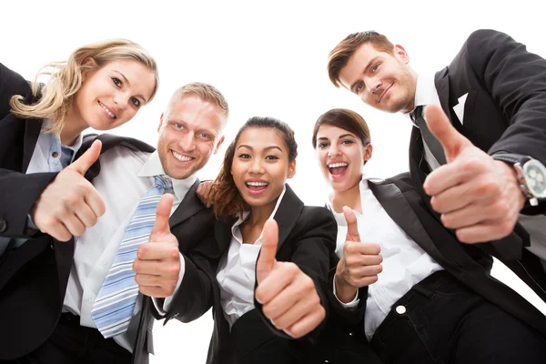 Portrait Of Business People Gesturing Thumbs Up Stock Photo