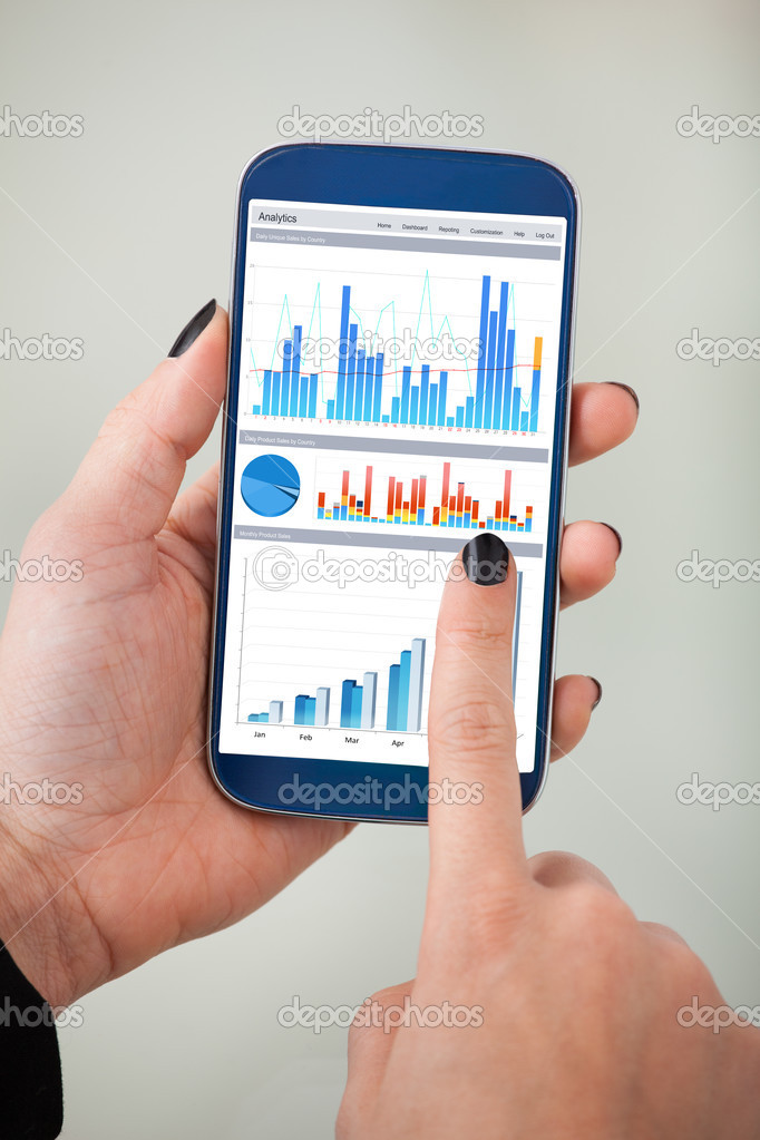 Businesswoman's Analyzing Charts On Smartphone