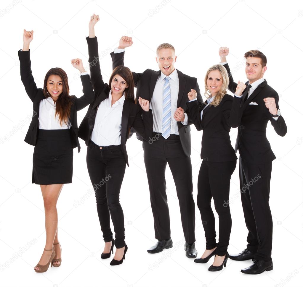 Successful Welldressed Businesspeople With Arms Raised