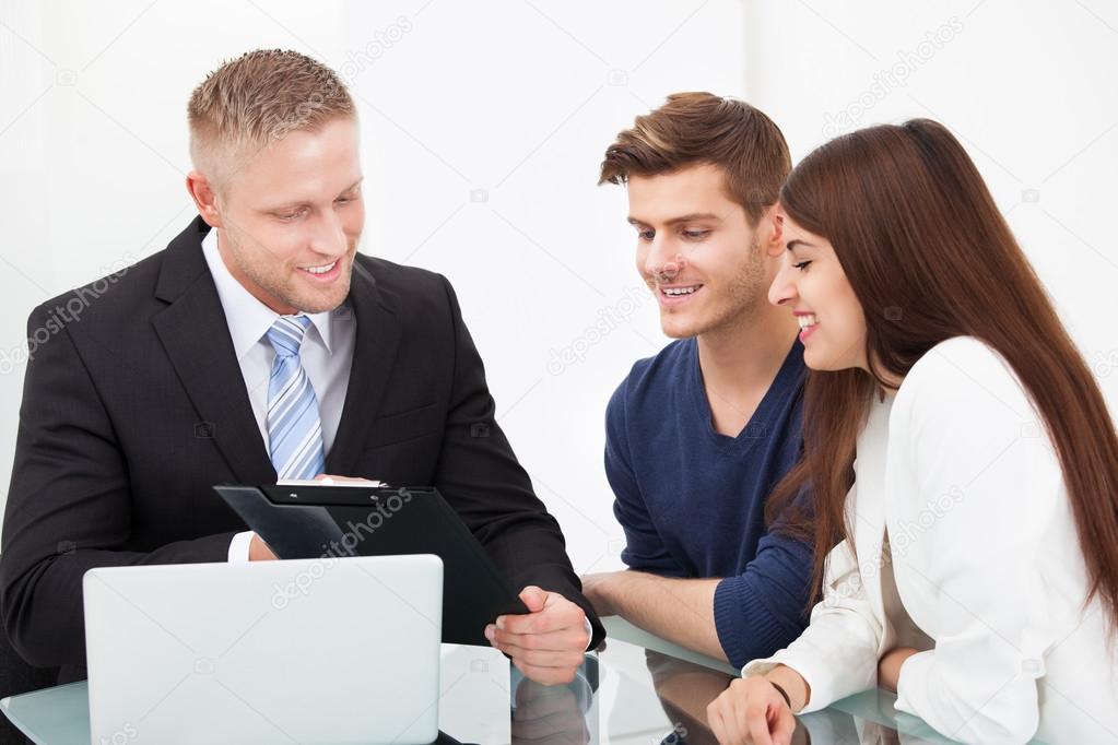 Couple Discussing With Financial Advisor
