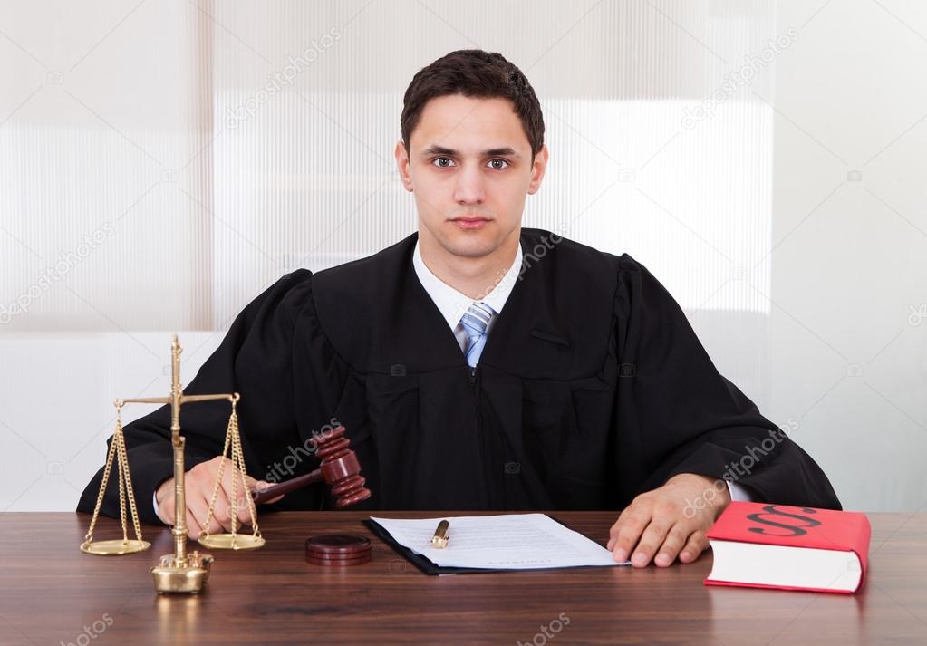 Confident Judge Sitting In Courtroom