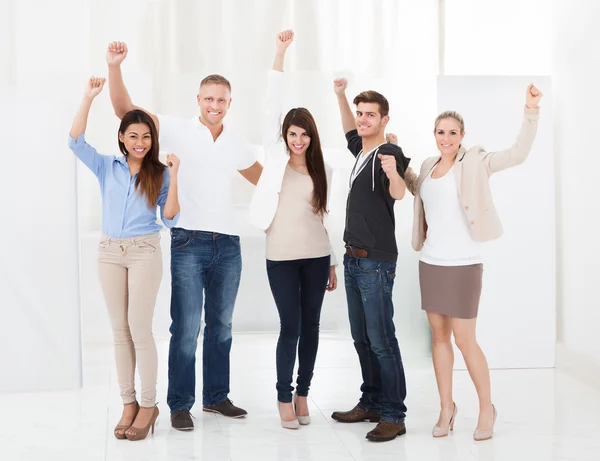 Confident Businesspeople Standing With Arms Raised — Stock Photo, Image