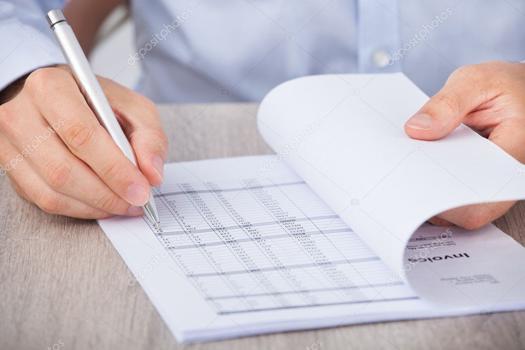 Businessman Calculating Accounts