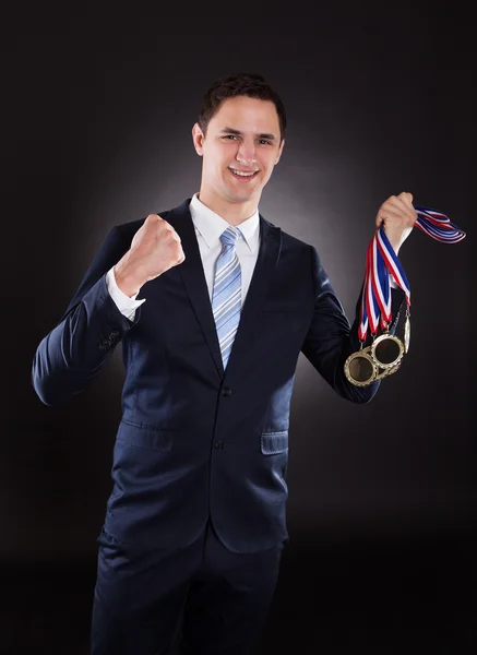 Smiling Businessman with Medals — Stock Photo, Image