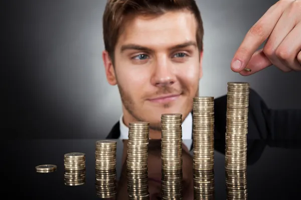 Businessman Stacking Coins — Stock Photo, Image