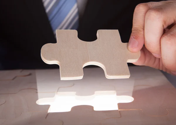 Businessman with puzzle — Stock Photo, Image