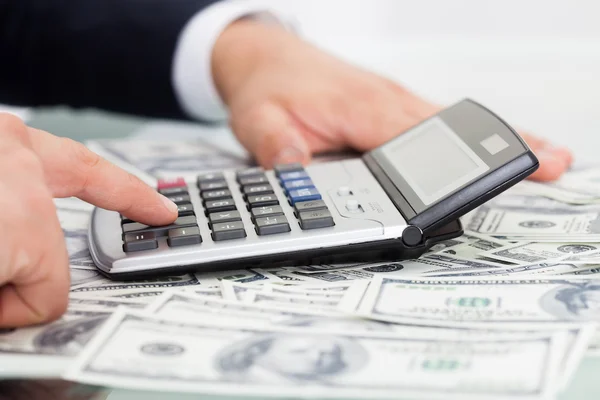 Businessman Calculating Money — Stock Photo, Image