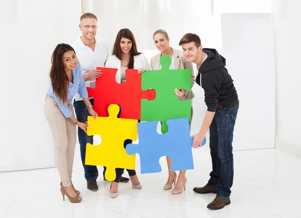 Businesspeople Joining Puzzle Pieces — Stock Photo, Image