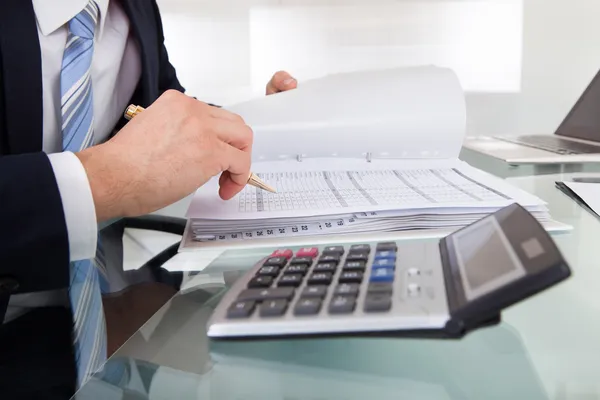 Businessman Calculating Expense — Stock Photo, Image