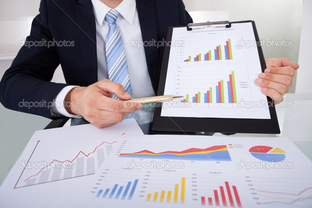Businessman Showing Graphs