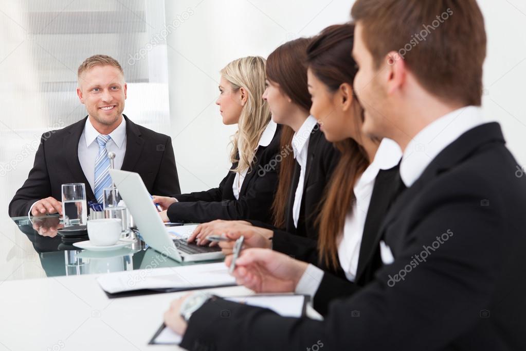 Businessman Looking At Colleagues In Meeting