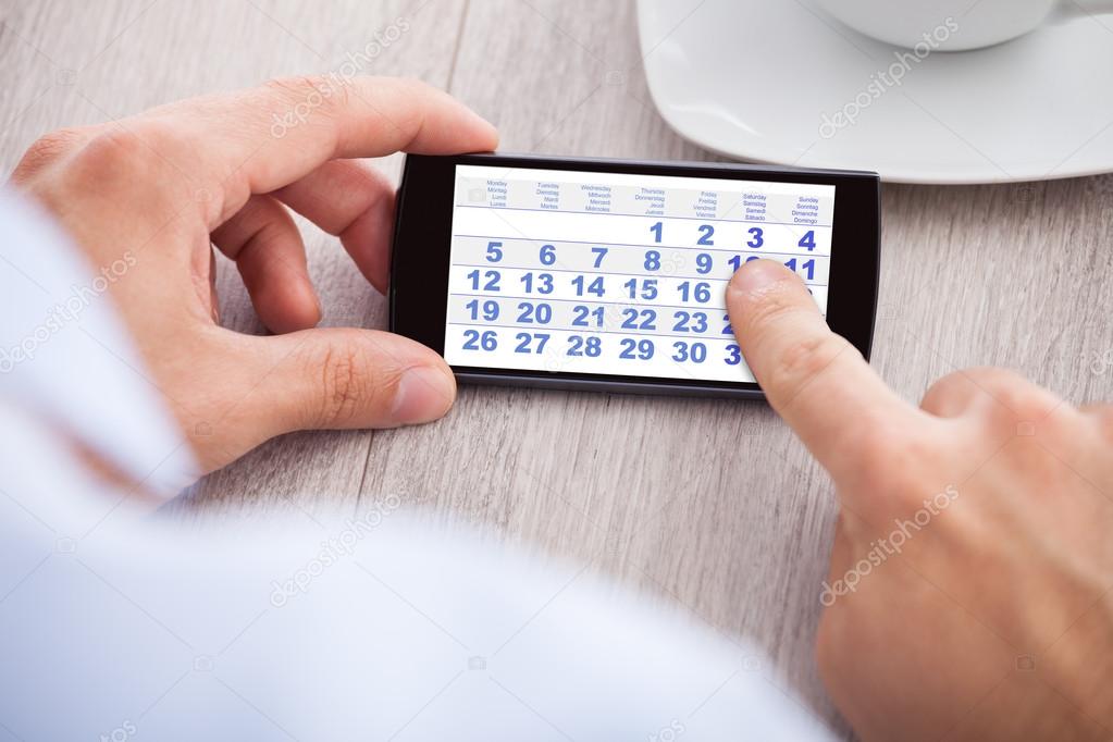 Businessman with Mobile Phone Calendar
