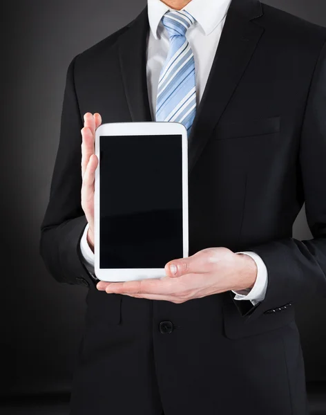 Businessman Showing Digital Tablet — Stock Photo, Image