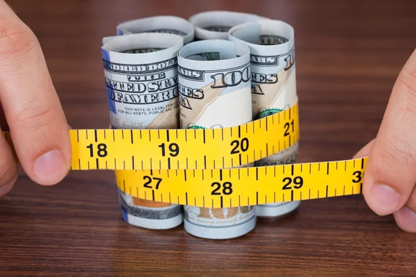 Hands Holding Banknote With Measure Tape — Stock Photo, Image