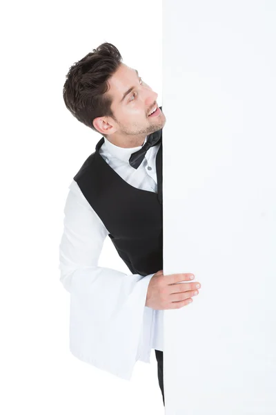 Butler Looking At Blank Billboard — Stock Photo, Image