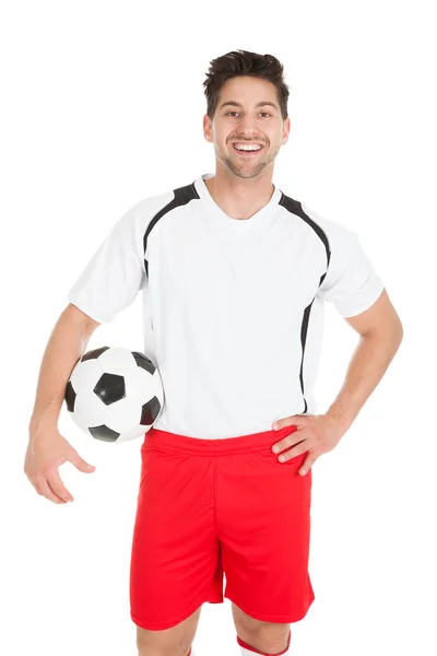 Jogador de futebol Segurando Futebol — Fotografia de Stock