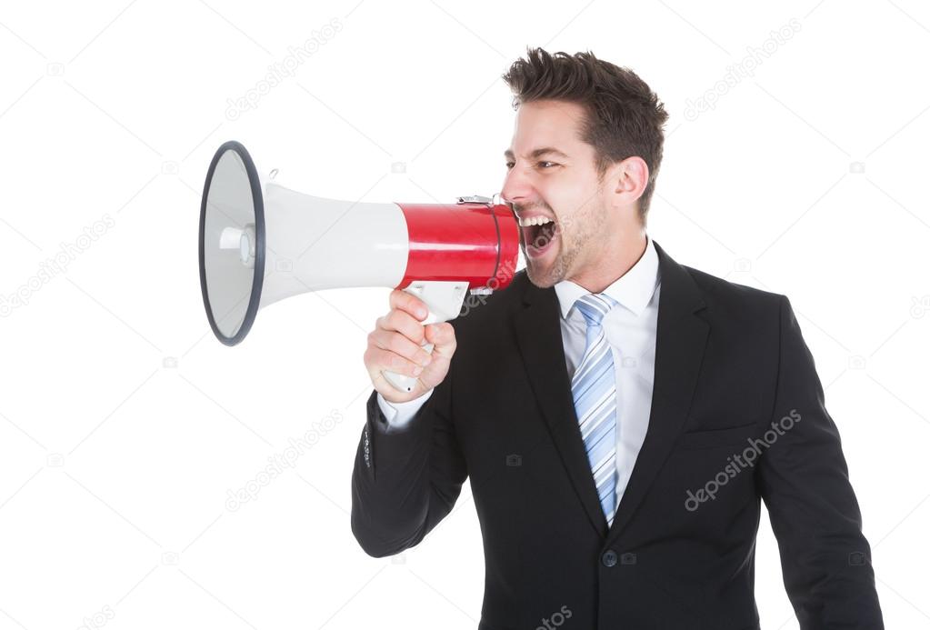 Businessman Screaming Into Megaphone