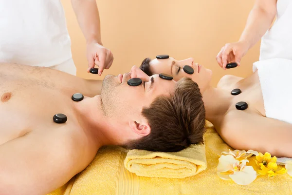 Couple Receiving Hot Stone Therapy — Stock Photo, Image