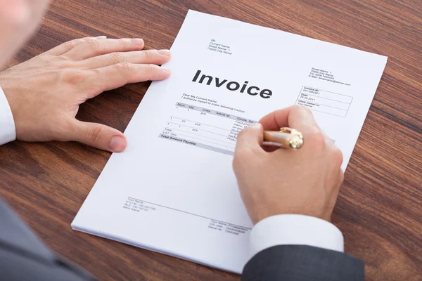 Businessman Calculating Invoice — Stock Photo, Image