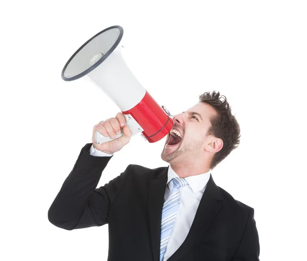 Бизнесмен кричит в мегафон — стоковое фото