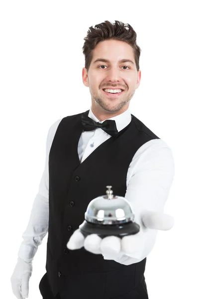 Waitperson holding dienst bell — Stockfoto