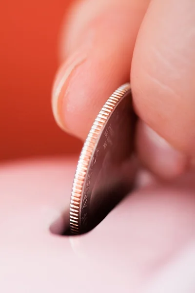 Hand Inserting Coin In Piggybank — Stock Photo, Image
