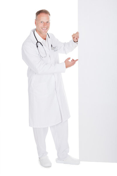 Male Doctor Displaying Billboard