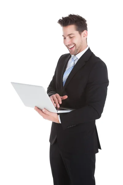 Businessman Holding Laptop Stock Image