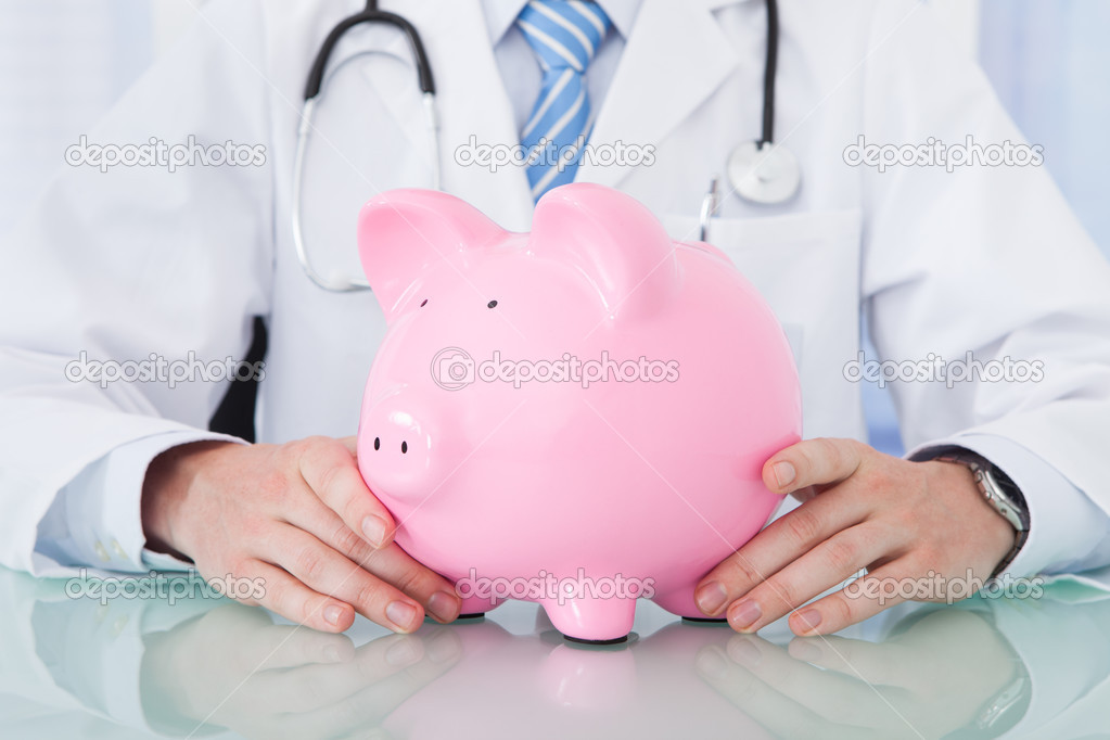 Doctor Holding Piggybank
