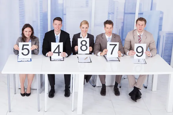 Business People Showing Score Cards — Stock Photo, Image