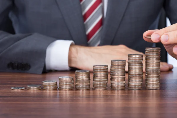 Businessman Stacking Coins — Stock Photo, Image