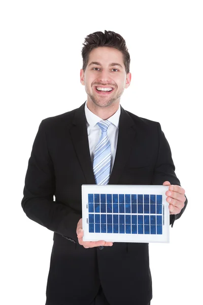 Empresário Segurando Painel Solar — Fotografia de Stock