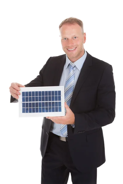 Empresário Segurando Painel Solar — Fotografia de Stock