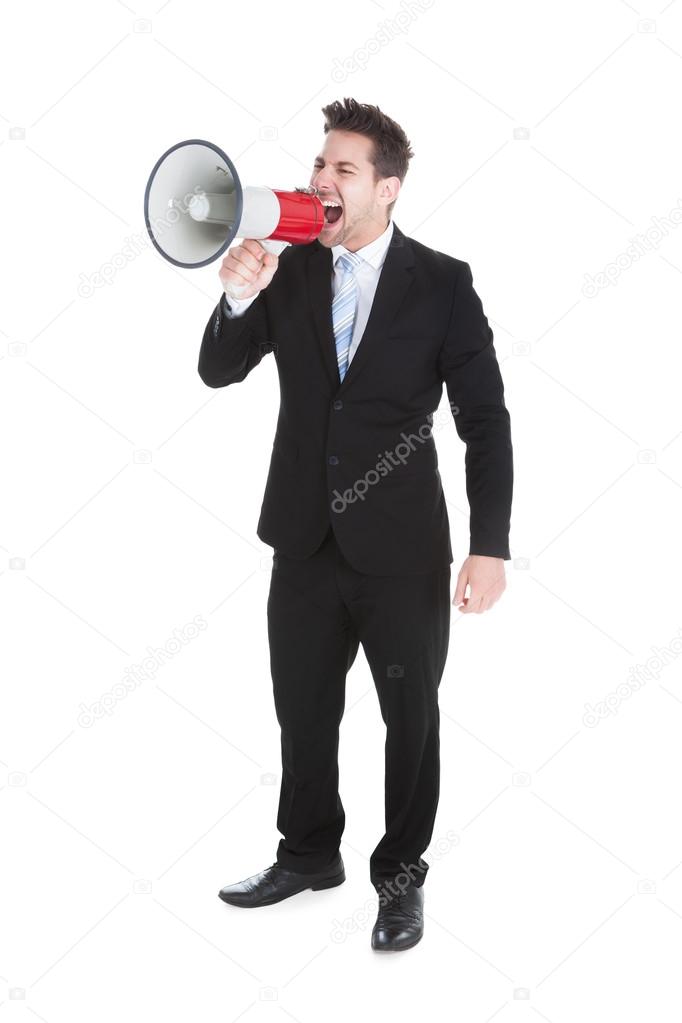 Businessman Screaming Into Megaphone