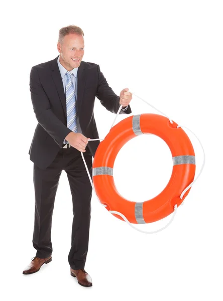 Businessman Holding Lifebuoy — Stock Photo, Image