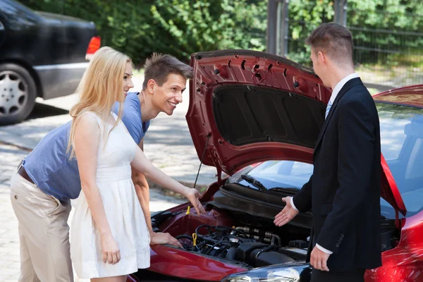 Salesman Showing New Car Engine — Stock Photo, Image