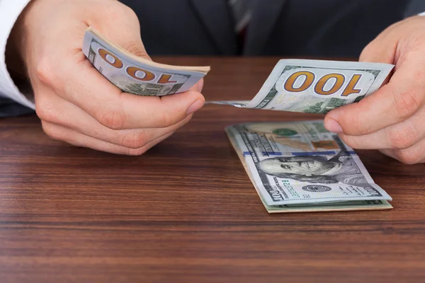 Businessman Counting Dollar Bills — Stock Photo, Image