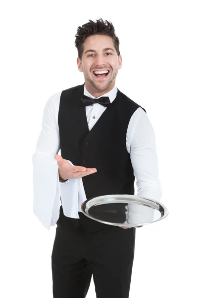 Официант держит пустой подающий лоток — стоковое фото