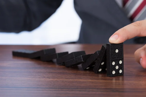 Businessman Playing Domino — Stock Photo, Image