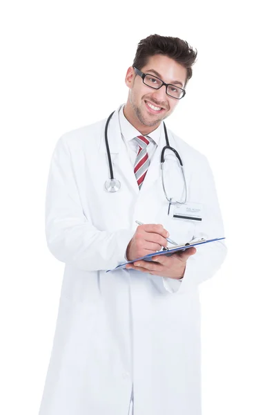 Male Doctor Writing On Clipboard — Stock Photo, Image